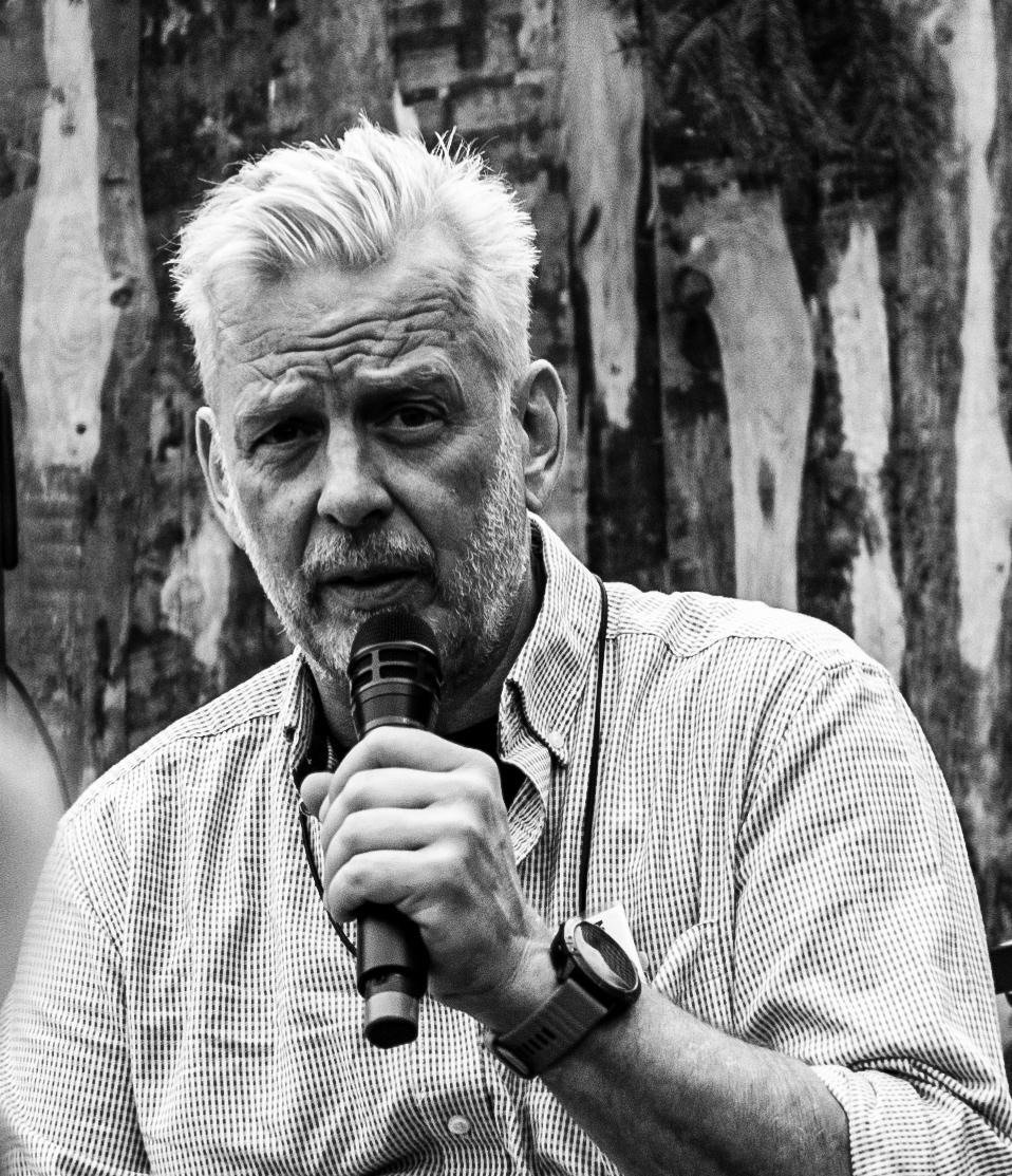 Michael Ohlhoff speaking with a microphone